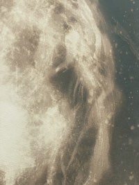 a black and white photo of a moon