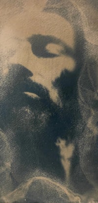 the face of jesus in the sand