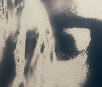 a black and white photo of a person's eye