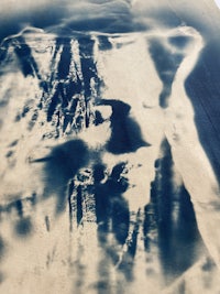 a blue and white painting on a wall