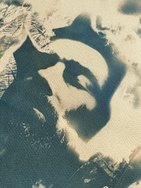 a black and white photo of a man with a beard